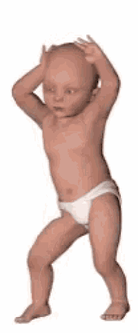 a baby in a diaper is standing with his hands in the air .
