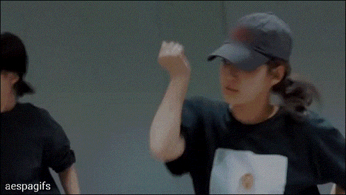 a woman wearing a black shirt with a picture on it