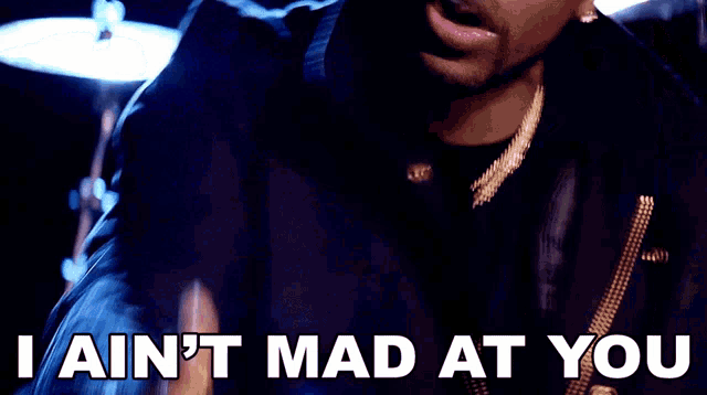 a man in a black jacket with the words i ain 't mad at you