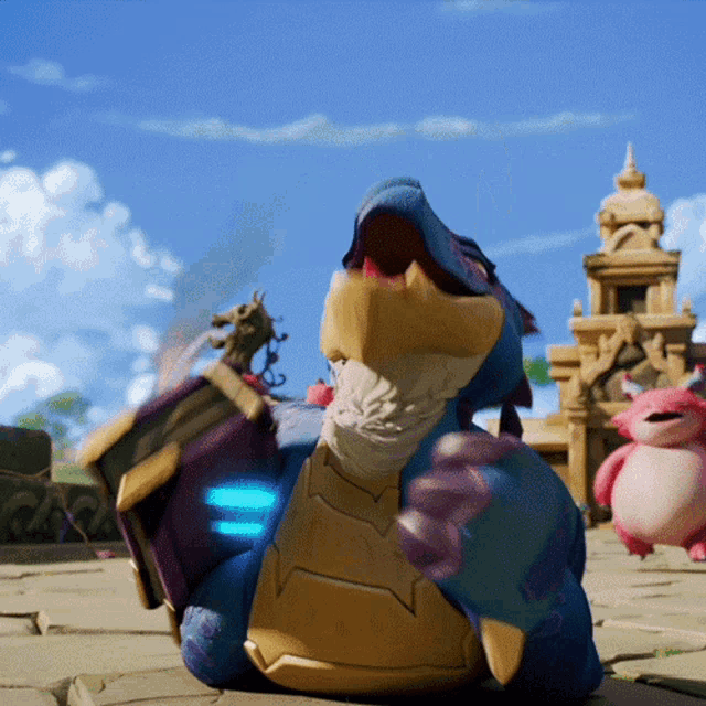 a blue and gold dragon with its mouth open is laying on the ground