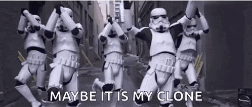 a group of stormtroopers are dancing in a line on a city street .