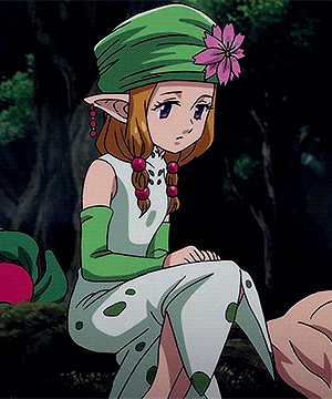 a girl in a green hat and white dress is sitting on a tree trunk .