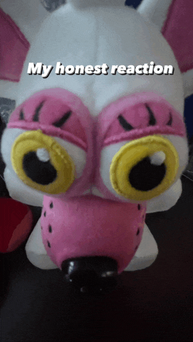a stuffed animal with big eyes and the words " my honest reaction " on the bottom