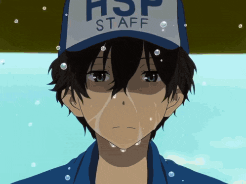 a boy wearing a hat that says hsp staff