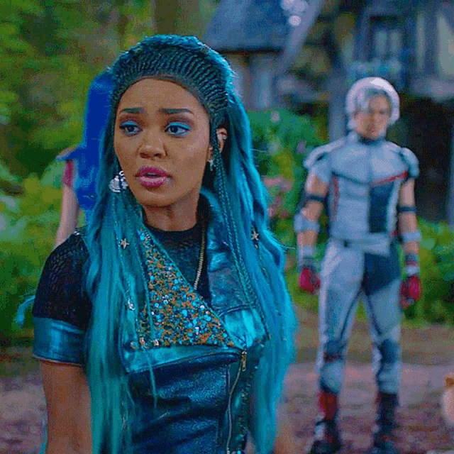 a girl with blue hair is wearing a black top