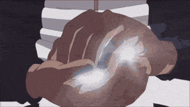 a close up of a person 's hands with a light coming out of them