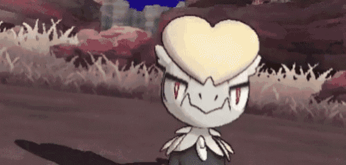 a cartoon character with a heart shaped head is standing in the grass .
