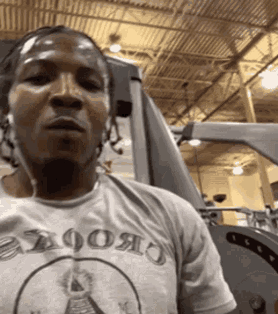 a man wearing headphones and a t-shirt that says apollo