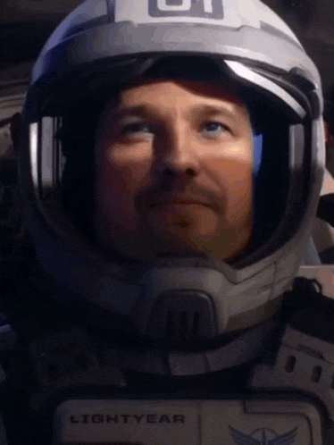 a man is wearing a helmet that says lightyear