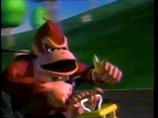 a donkey kong animated character is holding a banana in his hand
