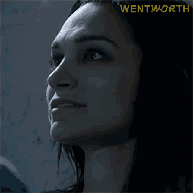 a close up of a woman 's face with the word wentworth on the bottom right