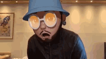 a cartoon man wearing a hat and glasses is standing in a room .