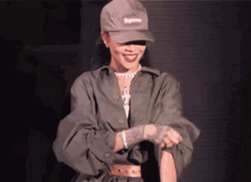 a woman wearing a hat that says supreme