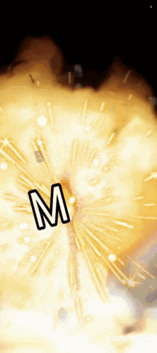 a firework display with the letter m in the center