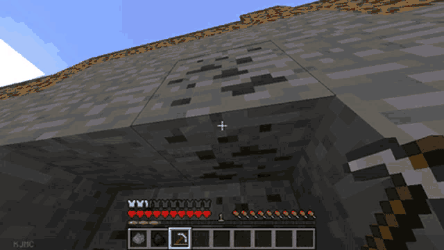 a screenshot of a game called minecraft with a hammer and a diamond