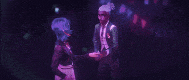 a man and a woman are standing next to each other and looking at each other .