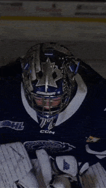 a hockey player wearing a helmet with the number 72
