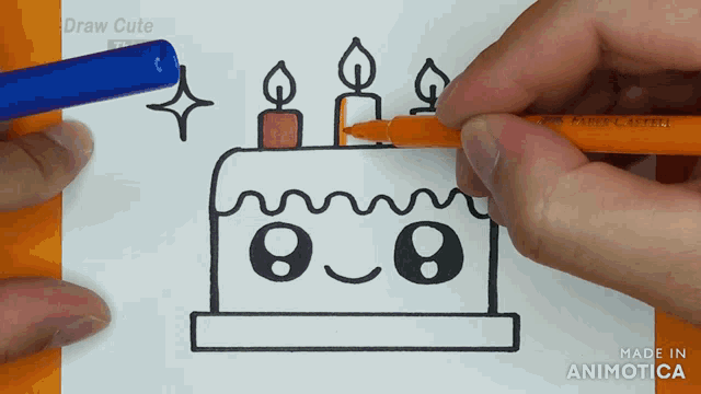 a person is drawing a birthday cake with candles and a face on it