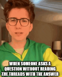 a young boy wearing glasses and a green and yellow hoodie is making a funny face .