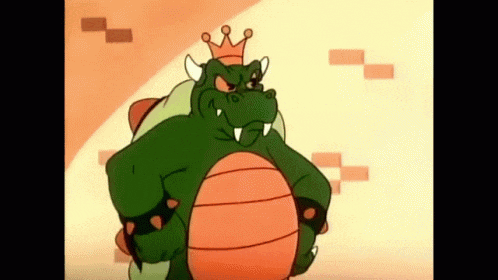 a cartoon character with a crown on his head is standing with his arms crossed .