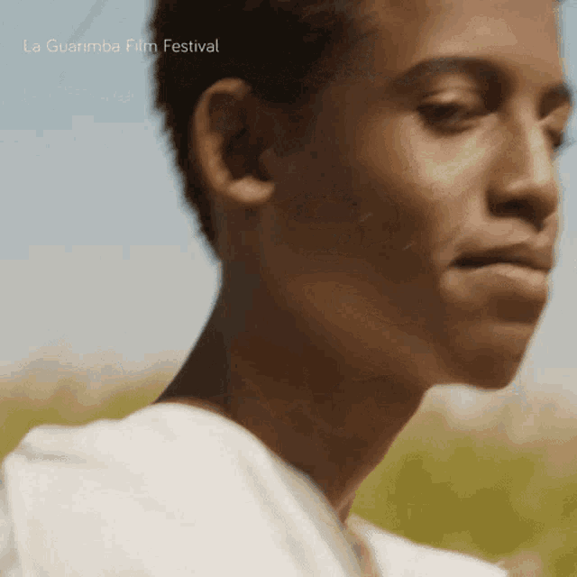 a close up of a person 's face with the words la guarimba film festival visible