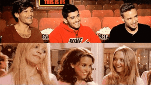 a man in a red nike sweatshirt sits in a theater