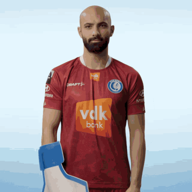 a man wearing a shirt that says vdk bank