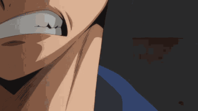 a close up of a man 's face with a very angry look on his face