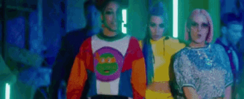 a group of women are standing next to each other in a room .