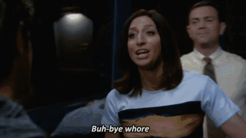 a woman says " buh-bye whore " in front of a man in a suit