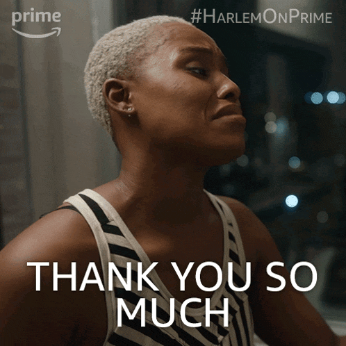 a woman says " thank you so much " in front of a picture of her