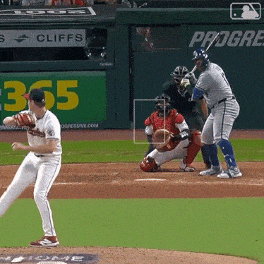 a baseball game is being played in front of a sign that says cliffs