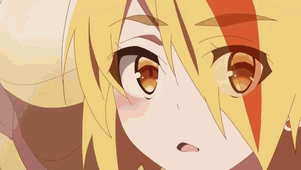 a close up of a cartoon character with yellow hair and orange eyes making a face .