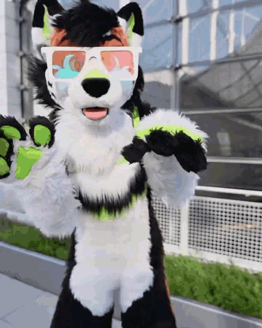 a furry animal wearing 3d glasses is standing on a sidewalk