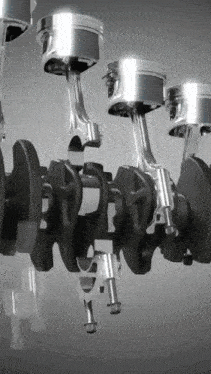 a close up of a crankshaft with four pistons on it