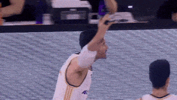 a basketball player wearing a white jersey with the number 40 on the front