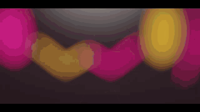 a bunch of pink and yellow hearts are floating in the air