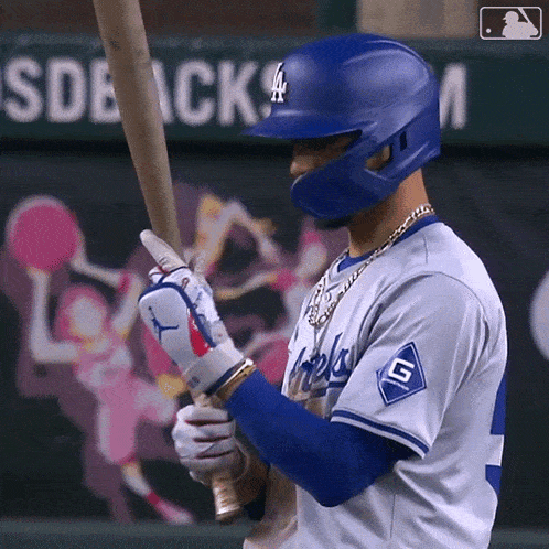 a dodgers baseball player is getting ready to hit the ball