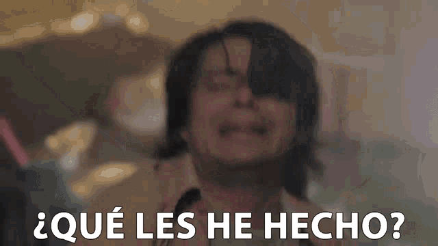 a man is crying and making a funny face with the words `` qué les he hecho '' .