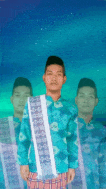 a man in a blue shirt is standing in front of a blue background with stars
