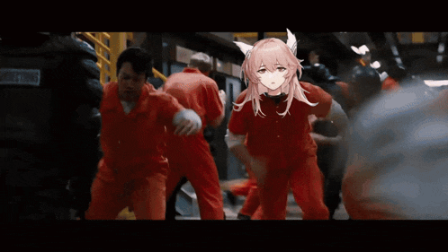 a girl with pink hair is standing in front of a crowd of people .