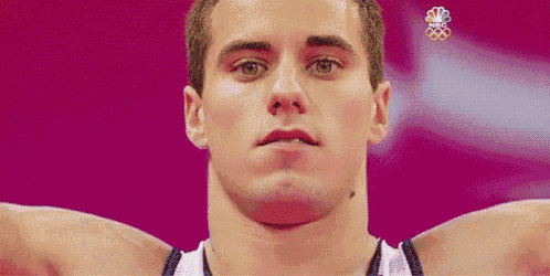 a close up of a man 's face with a nbc logo on the bottom right