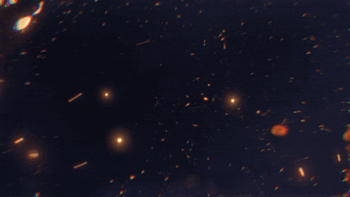 a dark background with a lot of sparkles in it