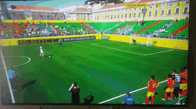 a soccer game is being played in a stadium with a sign that says boca do mundo