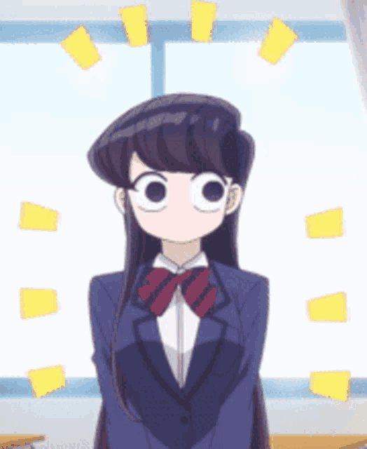 a girl in a suit and bow tie stands in front of a window