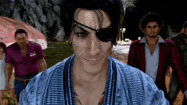 a man wearing an eye patch stands in front of a crowd