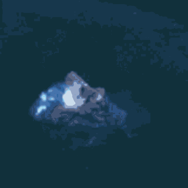 a ghost is flying through the air in a dark room in the dark .