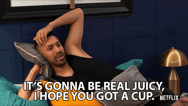 a man laying on a bed with the words " it 's gonna be real juicy , i hope you got a cup "