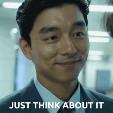 a man in a suit and tie is smiling with the words just think about it below him