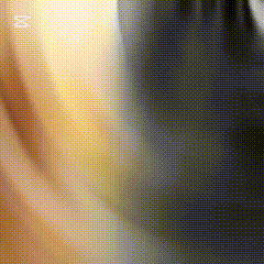 a blurry picture of a person 's face with a yellow background and a black background .